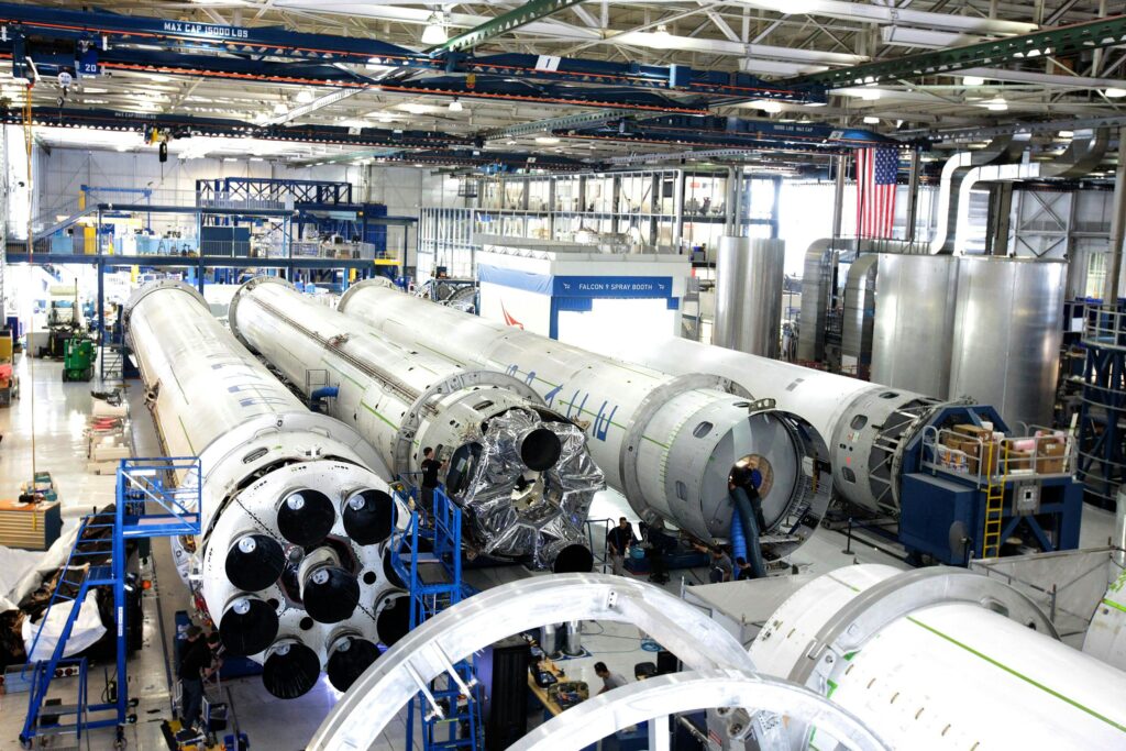 pexels-photo-256297-256297 View of a spacecraft assembly line with rockets in a spacious hangar.